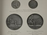 an old book with a bunch of different coins on it