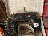 a tool box with a drill and other tools in it
