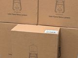 several boxes of items are stacked on top of each other on a table