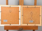 a picture of a wooden easel with two pictures on it