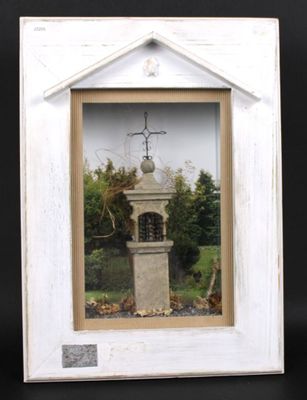 a picture of a white picture frame with a cross on it