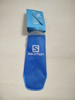 someone is holding a water bottle with a blue cover and a pair of scissors