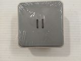 a picture of an electrical outlet on a white table