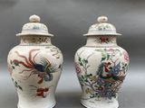 pair of chinese vases decorated with colorful birds and flowers