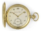an old gold pocket watch with roman numerals and roman numerals on the face