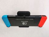 a nintendo wii game controller attached to a wall