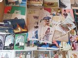 a lot of postcards on the floor of this room