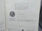 an open book with a picture of a clock on it