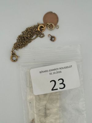 a small bag of white sugar cubes on a chain