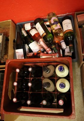 many bottles of wine in a box on the table