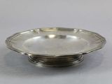 a silver plate with a flower design on the rim