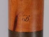a close up of a baseball bat with a wooden handle