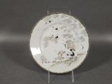 a white plate with a black and white design on it