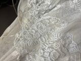 a close up of a white dress on a table