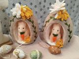 two stuffed animals that are sitting on a table