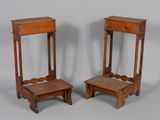 pair of antique wooden stools with a drawer on each of them