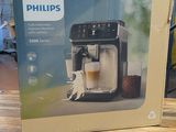 philips espresso coffee machine in box sitting on a wooden table