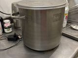 a large pot sitting on top of a table in a kitchen