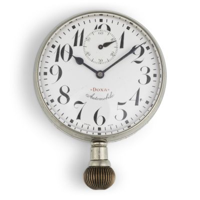 a clock that is hanging on the wall with numbers on it