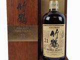 a bottle of japanese whisky in a wooden box