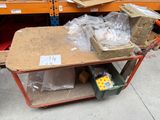 a cart that has a lot of items on it