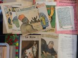 a lot of old french magazines on the table