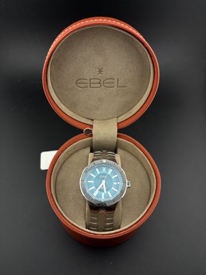 a close up of a watch in a box on a table