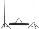 a black and white photo of a set of three tripod stands