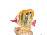 une figurine représentant un poisson posé sur un rocher