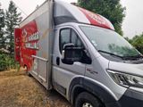 a delivery truck that is parked on the side of the road