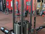 a gym room with a bunch of machines in it