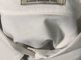 a close up of a white shirt with a label on it
