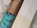 a blue yoga mat with a blue shoelacee on it