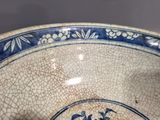 a blue and white bowl sitting on a table