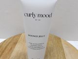 a close up of a tube of body lotion on a wooden table