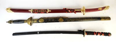 three different types of swords are displayed on a white surface