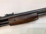 a close up of a rifle on display on a table