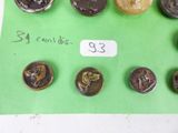 a lot of coins that are on a green piece of paper