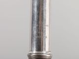 a close up of a silver metal object on a table