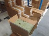 many boxes stacked on top of each other in a warehouse