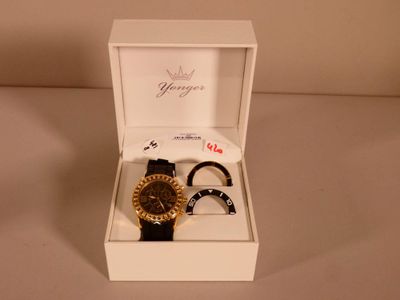 two watches in a white box on a table
