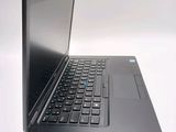 a laptop computer that is sitting on a white table
