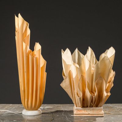 two vases that are sitting on a table