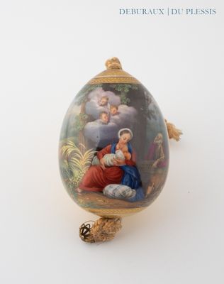 an egg with a picture of a woman and a child on it