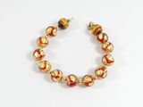 bracelet en perles de verre dorées et rouges, rehaussé de détails dorés