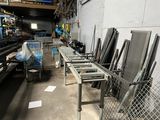 a lot of chairs that are lined up in a warehouse