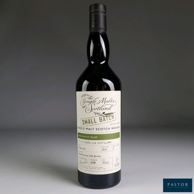 the bottle of small batch wine is sitting on the table