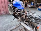 a motorcycle that has a blue helmet on the back of it