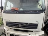 a white truck that is parked on the side of the road