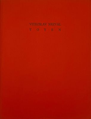 a red book with black writing on the cover